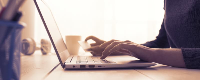 Woman doing online shopping with a credit card
